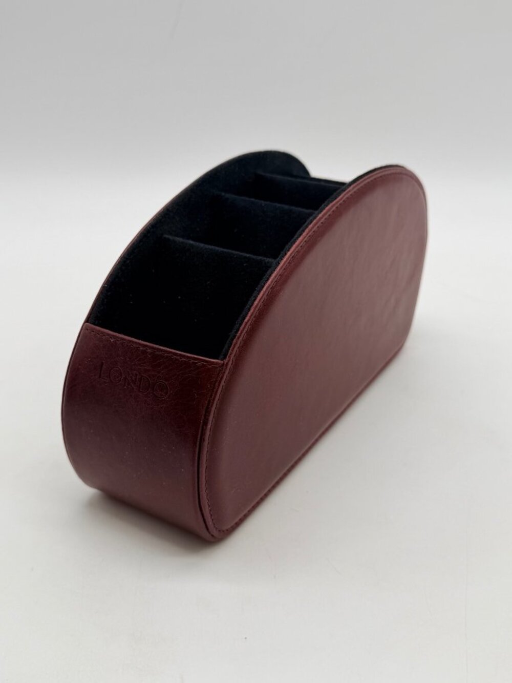 red Londo brand remote control holder features five compartments for organizatio